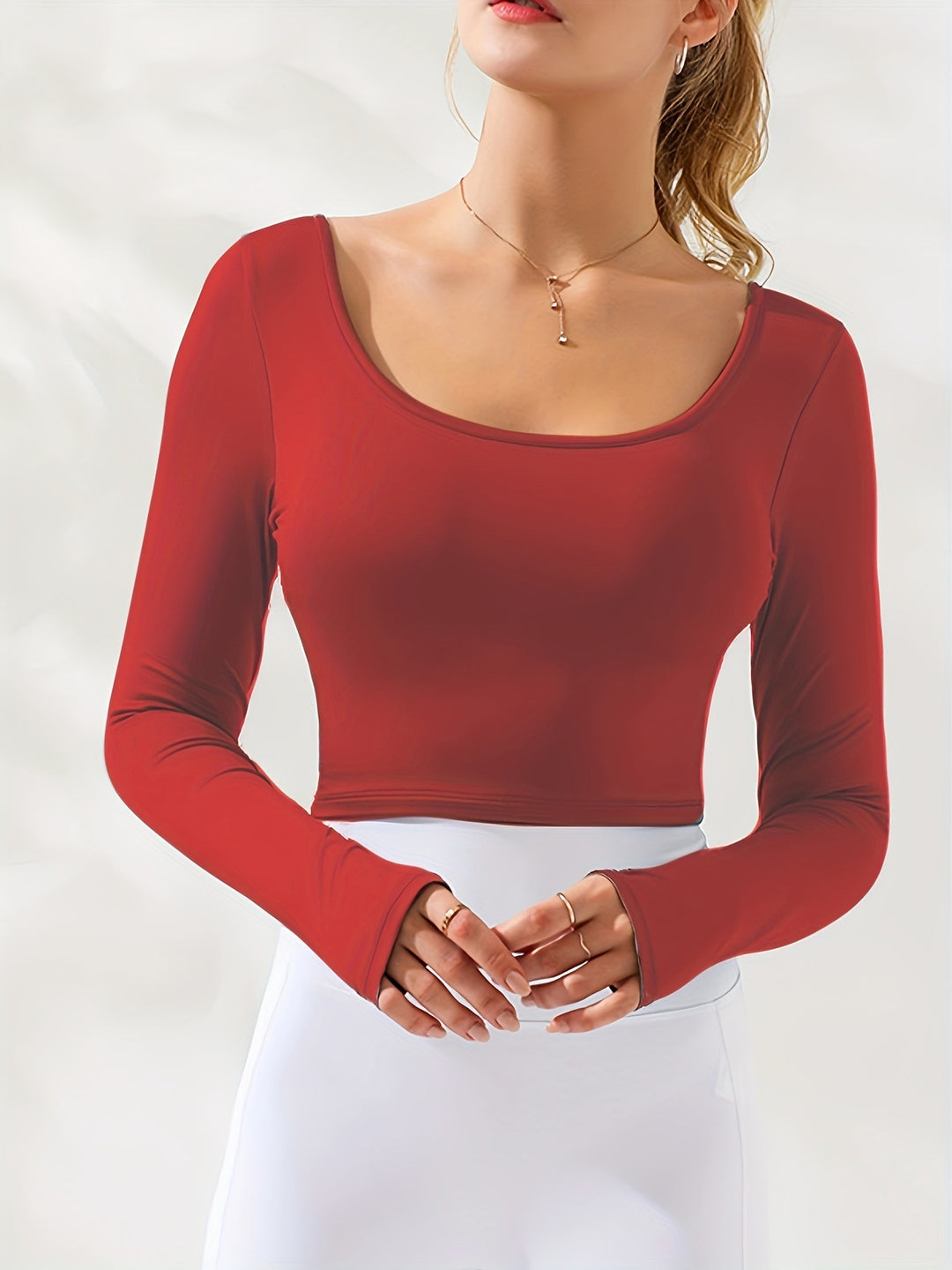 Damen figurbetontes Langarmoberteil mit Rundhalsausschnitt und Daumenlöchern Heidi-Mode