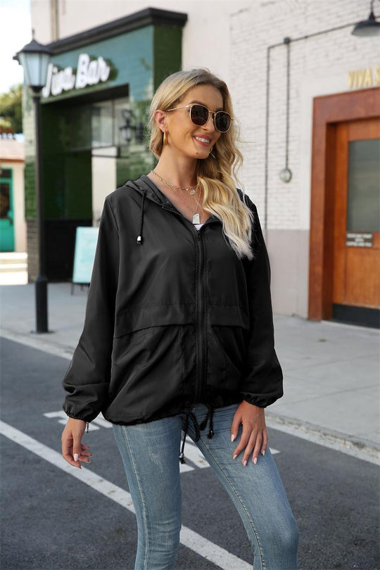 Damen leichte und atmungsaktive Windbreaker-Jacke mit verstellbarem Kapuzenkragen Heidi-Mode