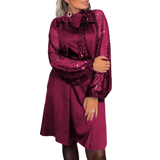 Damen Schickes Cocktailkleid mit glitzernden Puffärmeln und eleganter Schleife Heidi-Mode