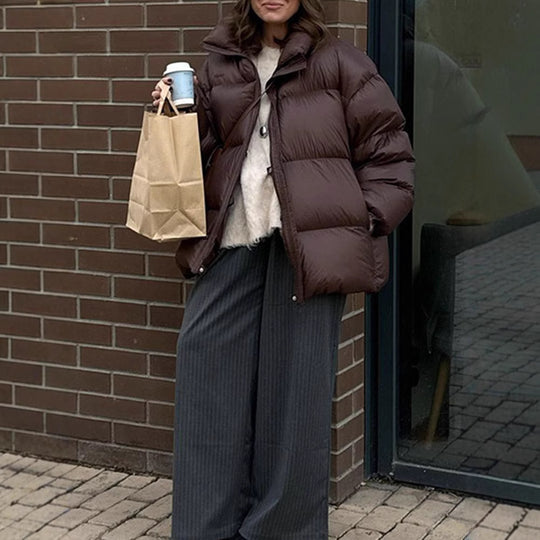 Damen Steppjacke im oversized Schnitt mit hohem Kragen und Taschen Heidi-Mode