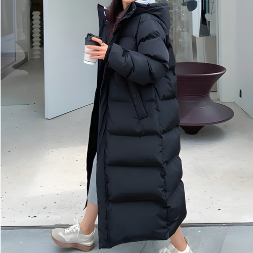Heidi-Mode | Pufferjacke mit schrägen Taschen, Reißverschluss, Kapuze und langem Schnitt mit dicken Taschen