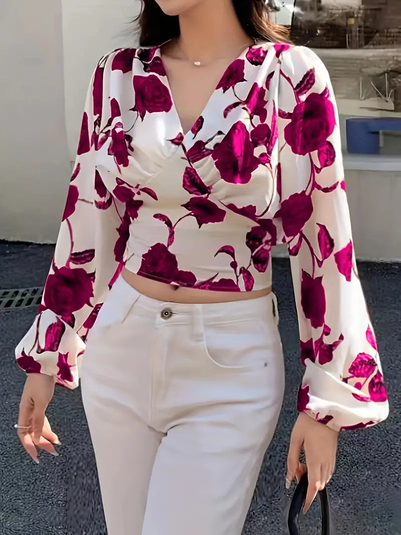 blouse met V-hals en strik op de rug met rozenprint