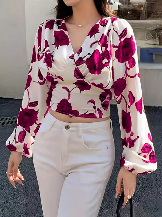 blouse met V-hals en strik op de rug met rozenprint