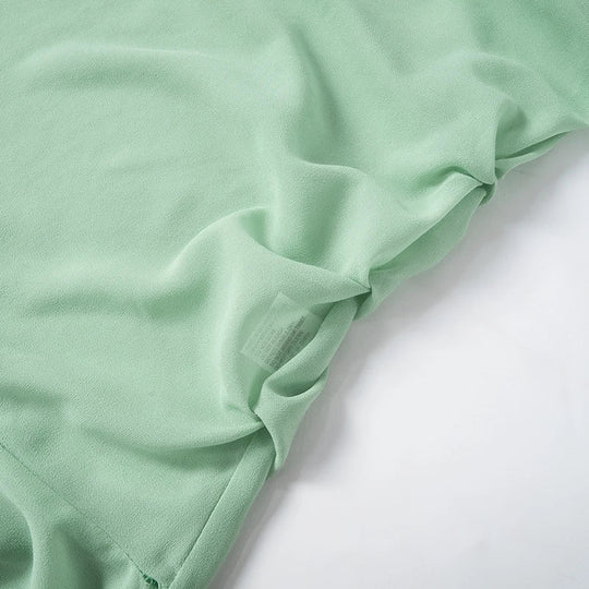 Luftiges mintgrünes Kleid mit Rüschenschichten