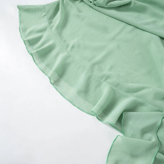 Luftiges mintgrünes Kleid mit Rüschenschichten