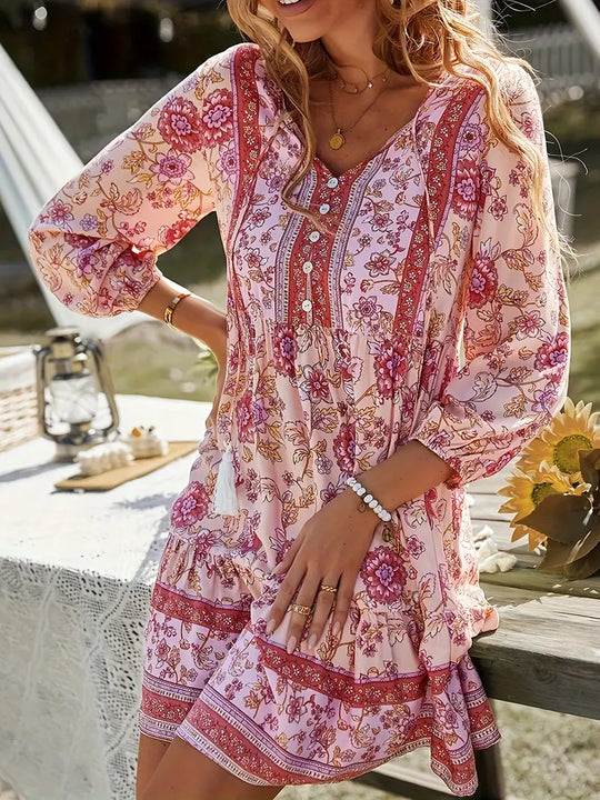 Boho jurk met bloemenprint en kwastjes om te strikken met ruches aan de zoom